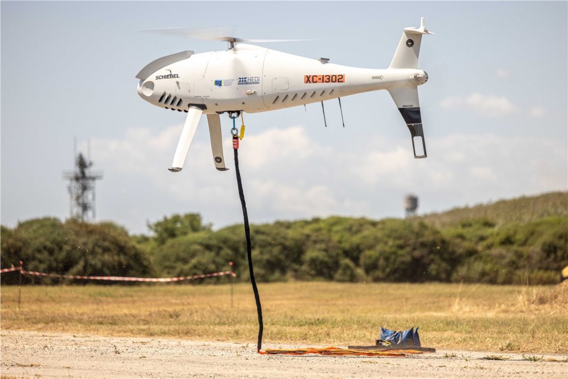 Schiebel CAMCOPTER S-100, European Defence Agency, autonomous logistics drones, unmanned air systems, UAS logistics missions, cross-domain operations, military drone technology, defense interoperability, aerial cargo transport, Drones World Magazine